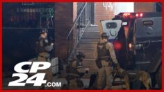 Hamilton police conduct raids in search of murder suspect